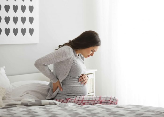 Pregnant,Woman,Suffering,From,Pain,In,Bedroom